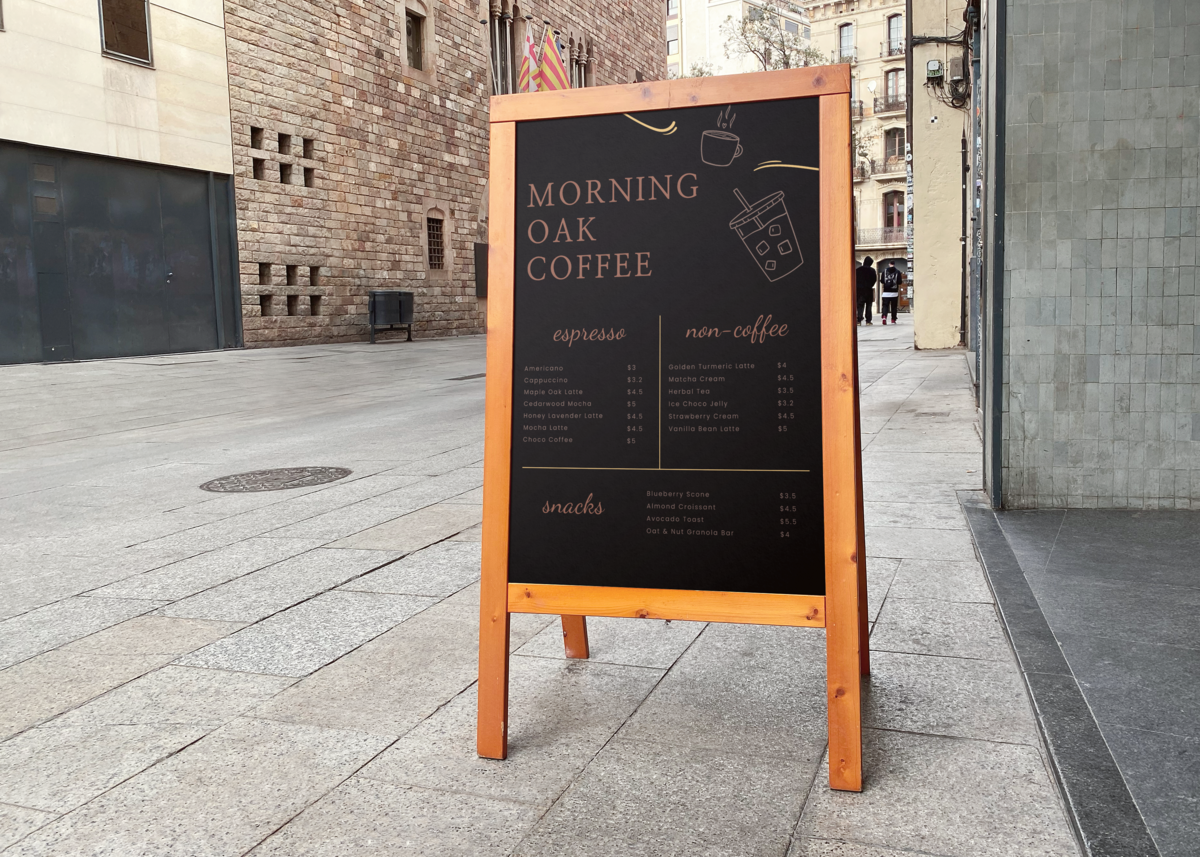 Black sandwich board outside on a city street with "MORNING OAK COFFEE" at the top. Menu is divided into sections for espresso, non-coffee, and snacks, listing items like Americano, Vanilla Bean Latte, and Blueberry Scone.