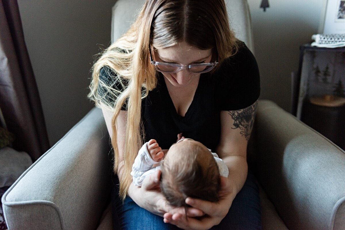 mom talking to newborn boy