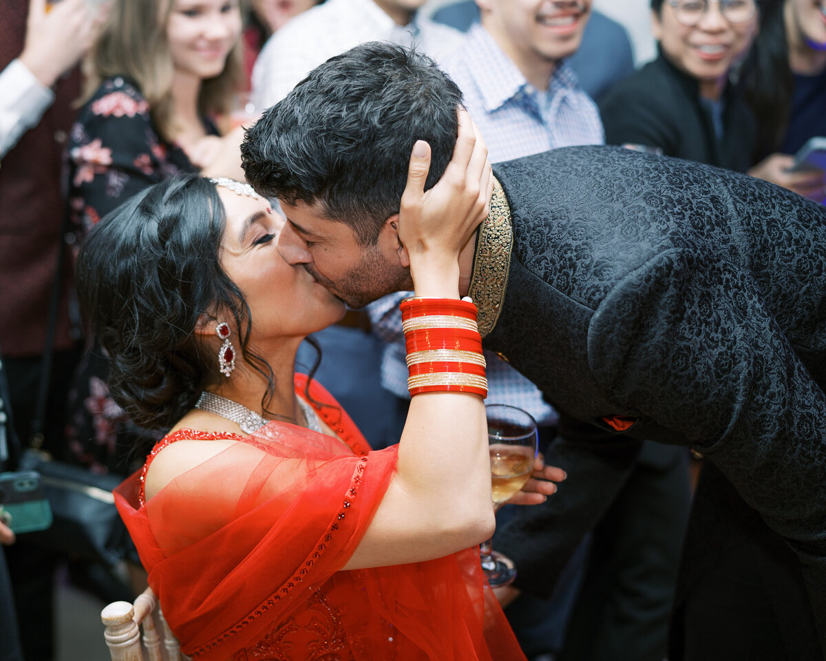 Bride and groom at evening wedding reception after Sikh wedding ceremony