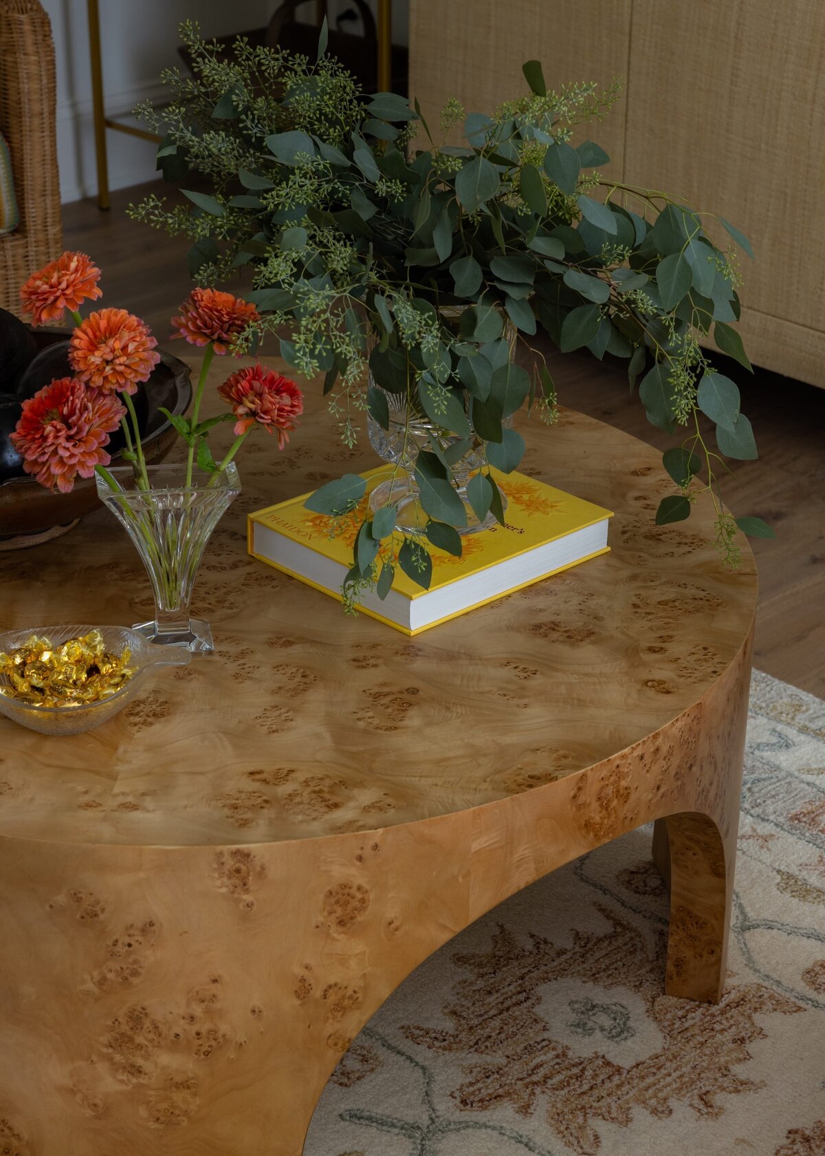 melinda chesson interiors poindexter wooden round coffee table with yellow book
