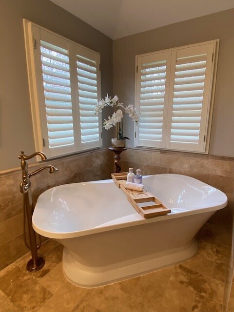 Staged bathtub with orchid