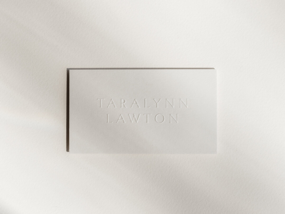 Business card with embossed lettering.