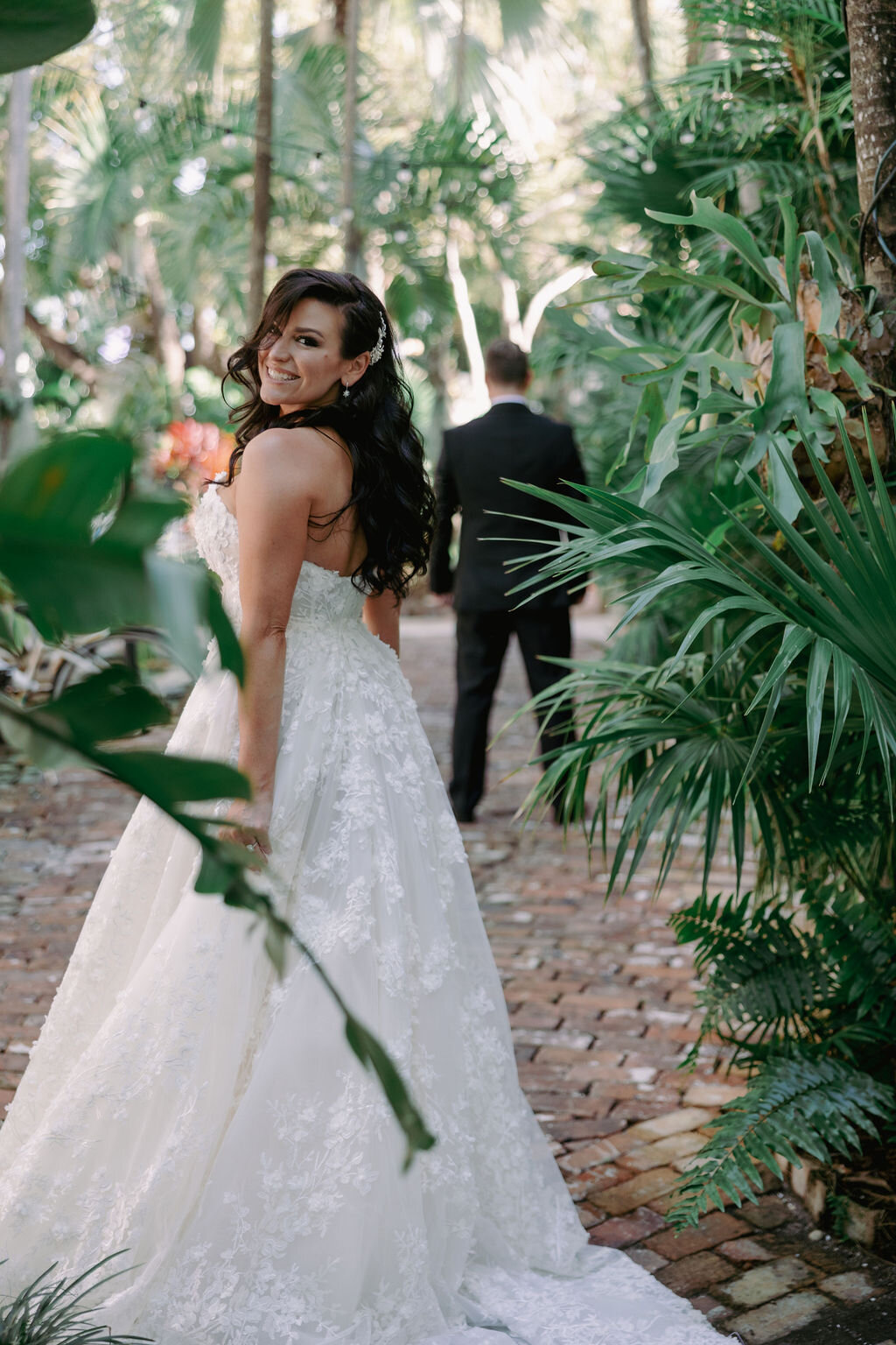 A bride and groom pose at the Palm Ceia Presbyterian Church in Tampa, Florida