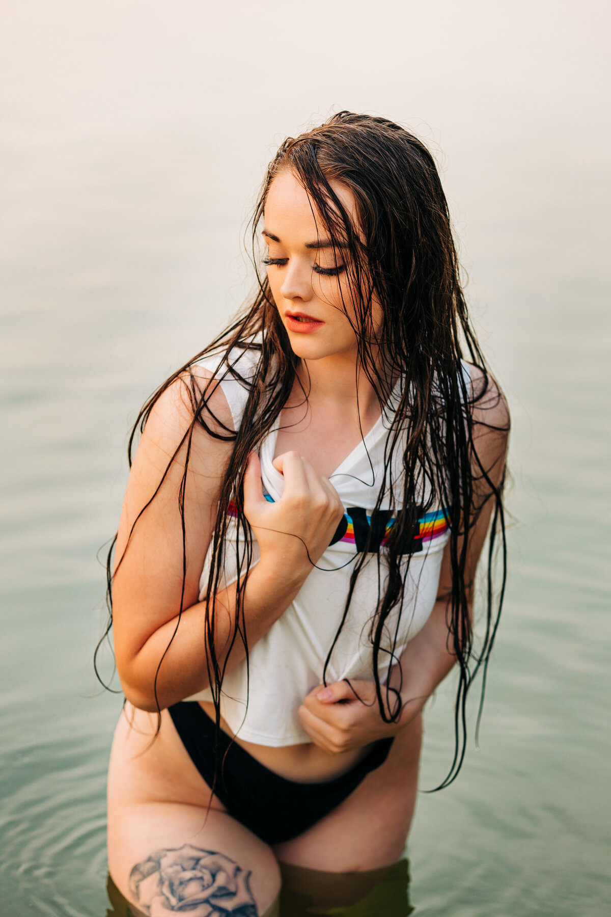 Outdoor boudoir photo woman standing in Clark Fork River in Missoula, MT