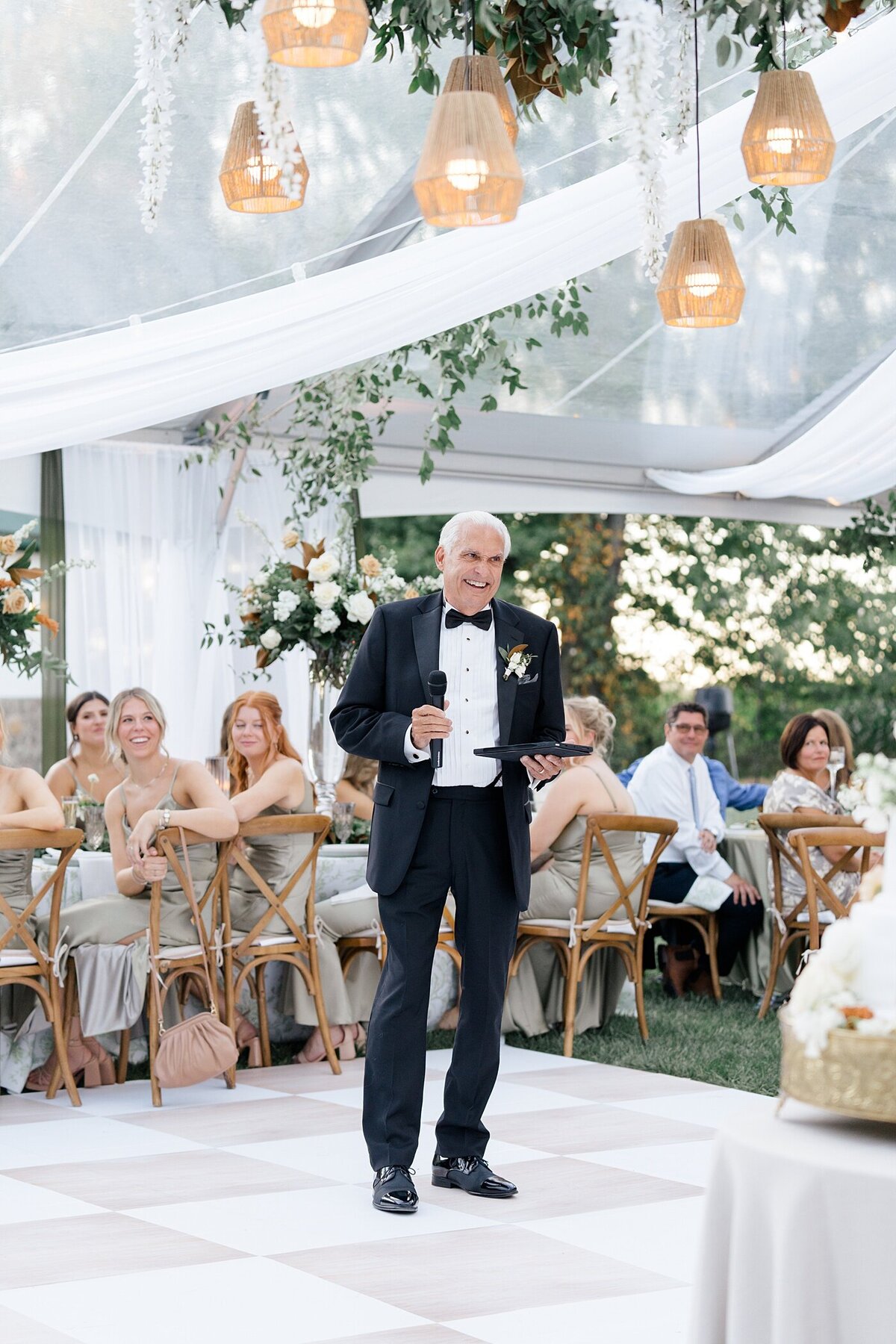 father of the bride shares a speech in a white tent wedding captured by Columbus wedding  photographer