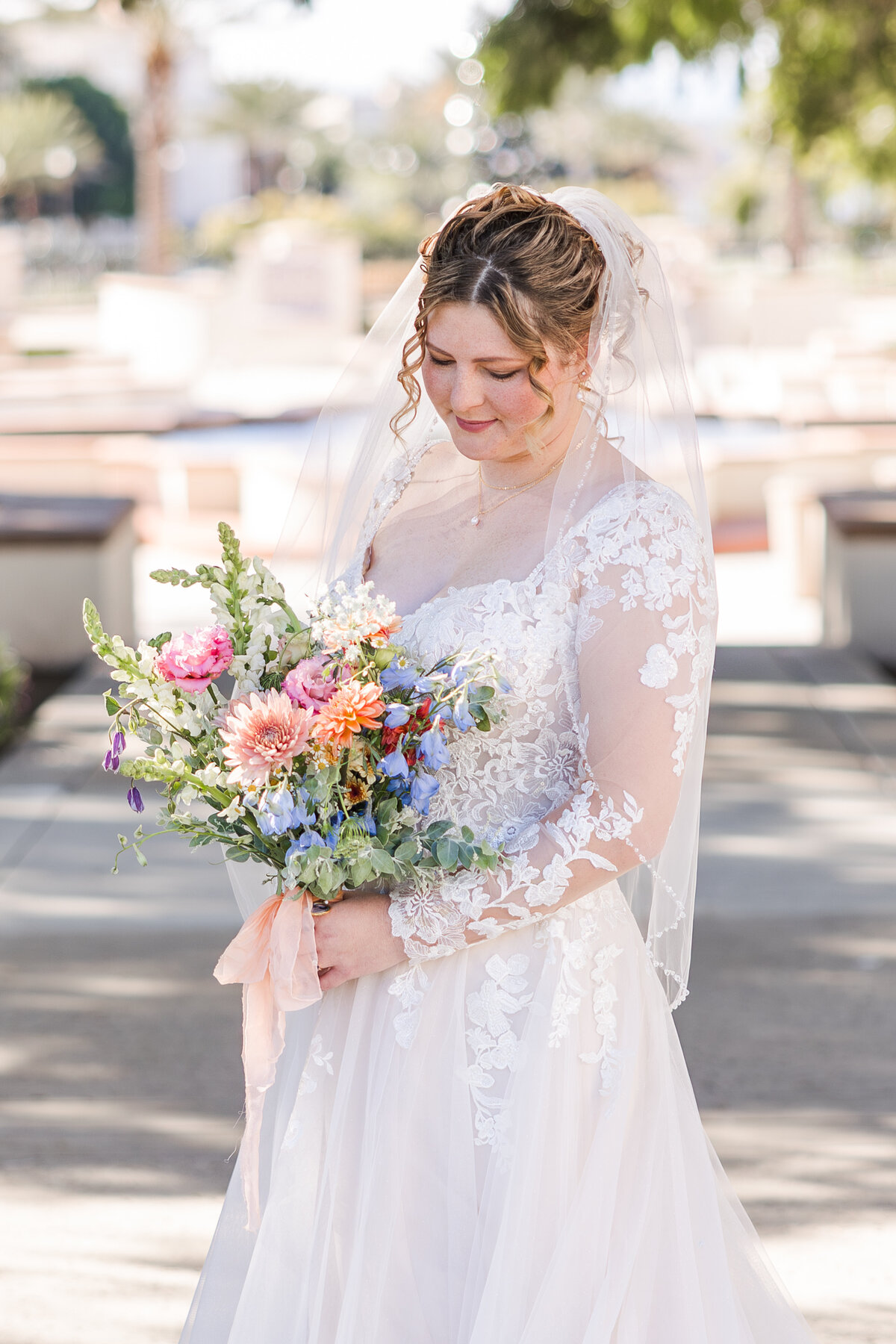 bride-looking-at-bouquet