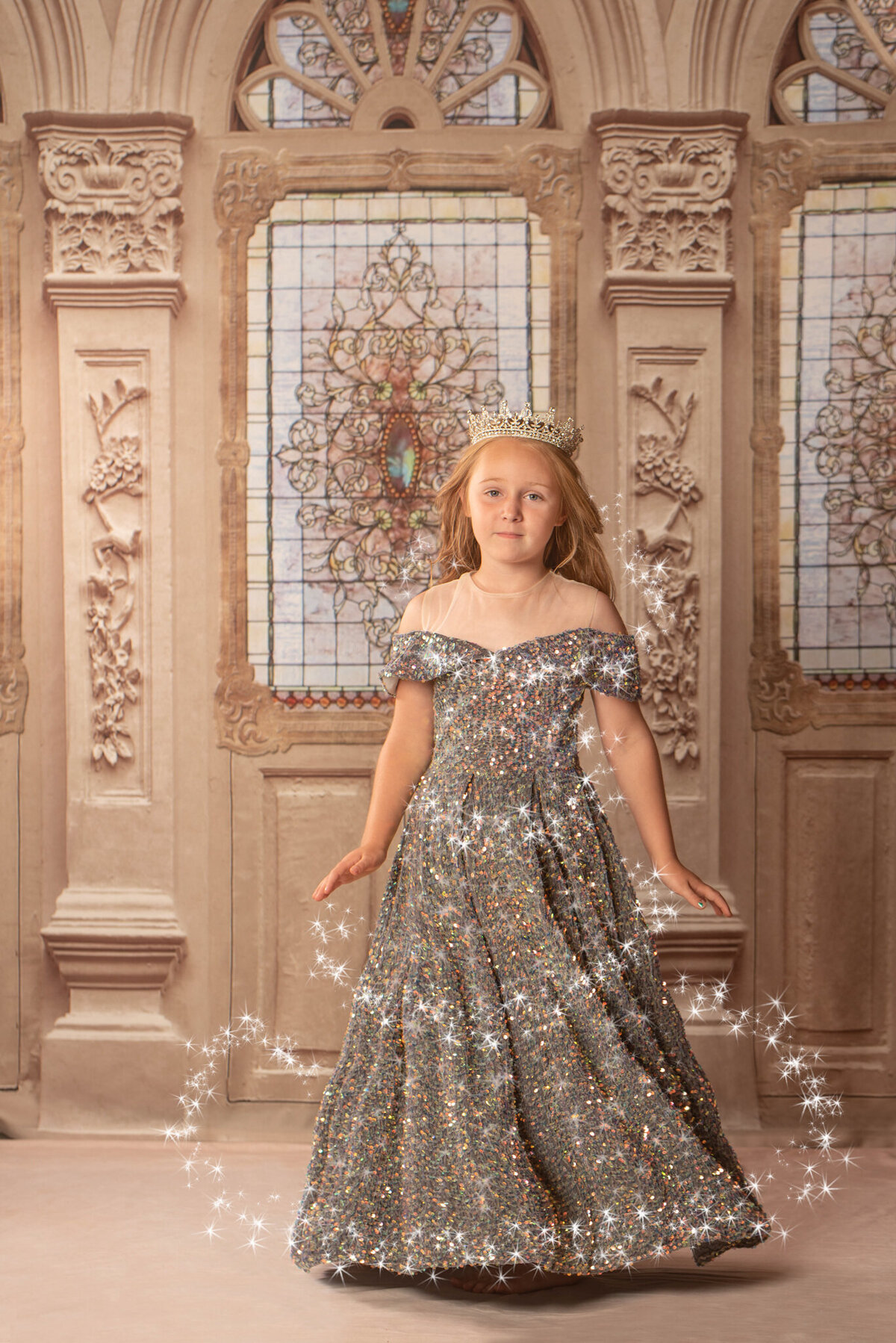Elegant portrait of a young girl in a shimmering gown, posed in a fairytale-inspired castle setting. Captured in Overland Park, Kansas, this enchanting setup is perfect for families seeking formal and magical child photography.