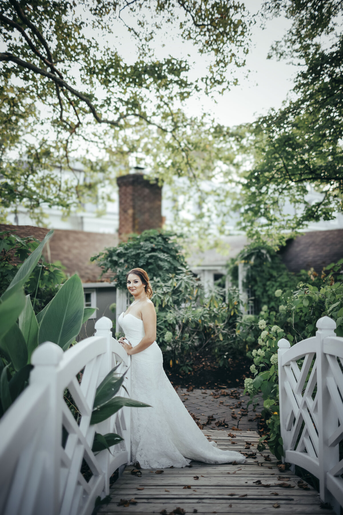 the-inn-at-barley-sheaf-bride-posing-on-white-bridge-holicong-pennsylvania