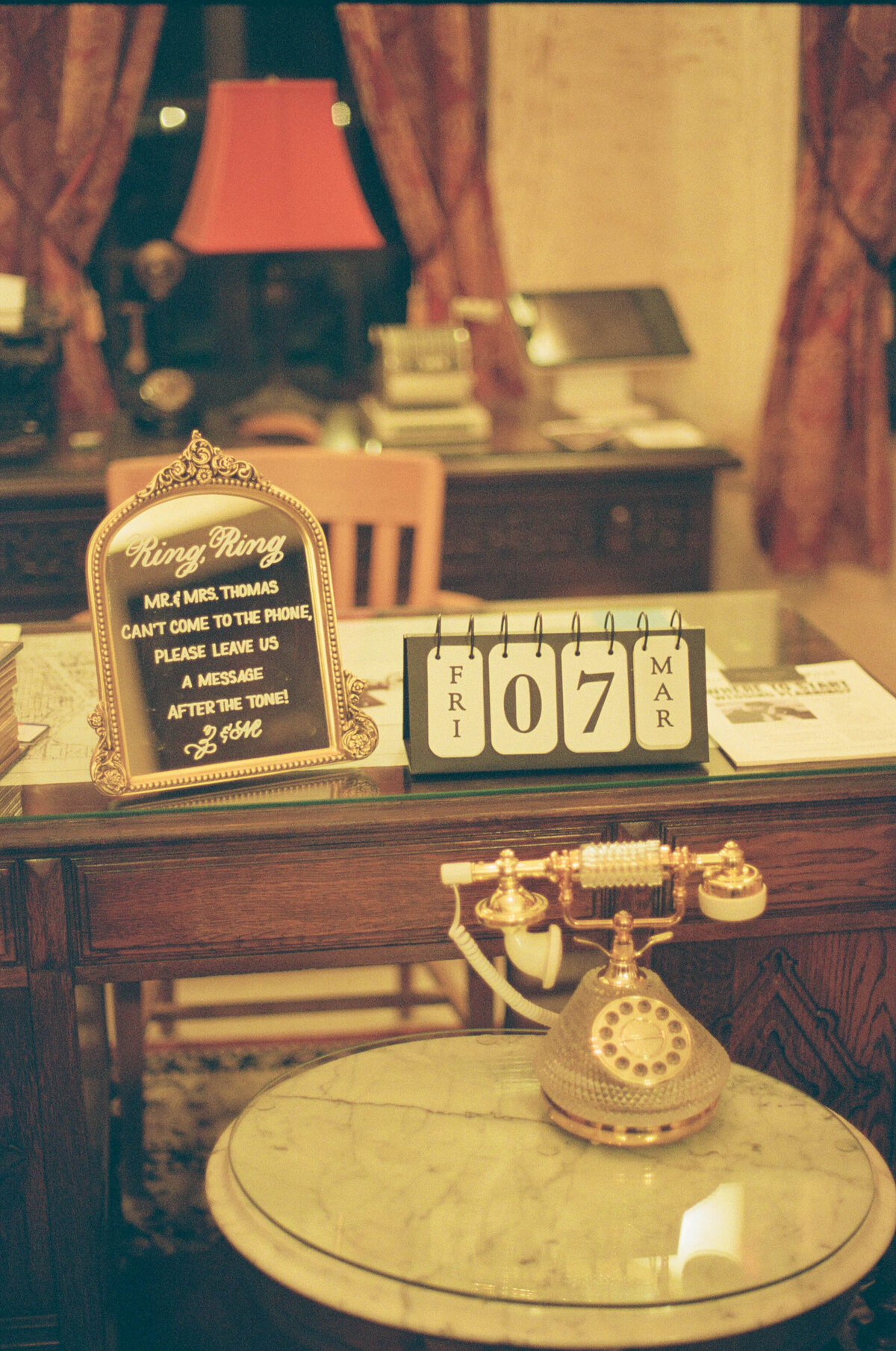 5x7 and 8x10 gold mirrors with ornate decor on the top and calligraphy for guestbook sign