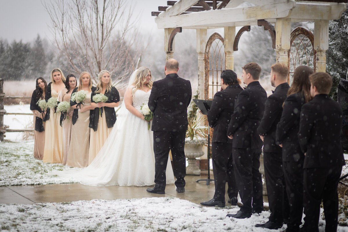 Snow covered wedding ceremony and reading of vows