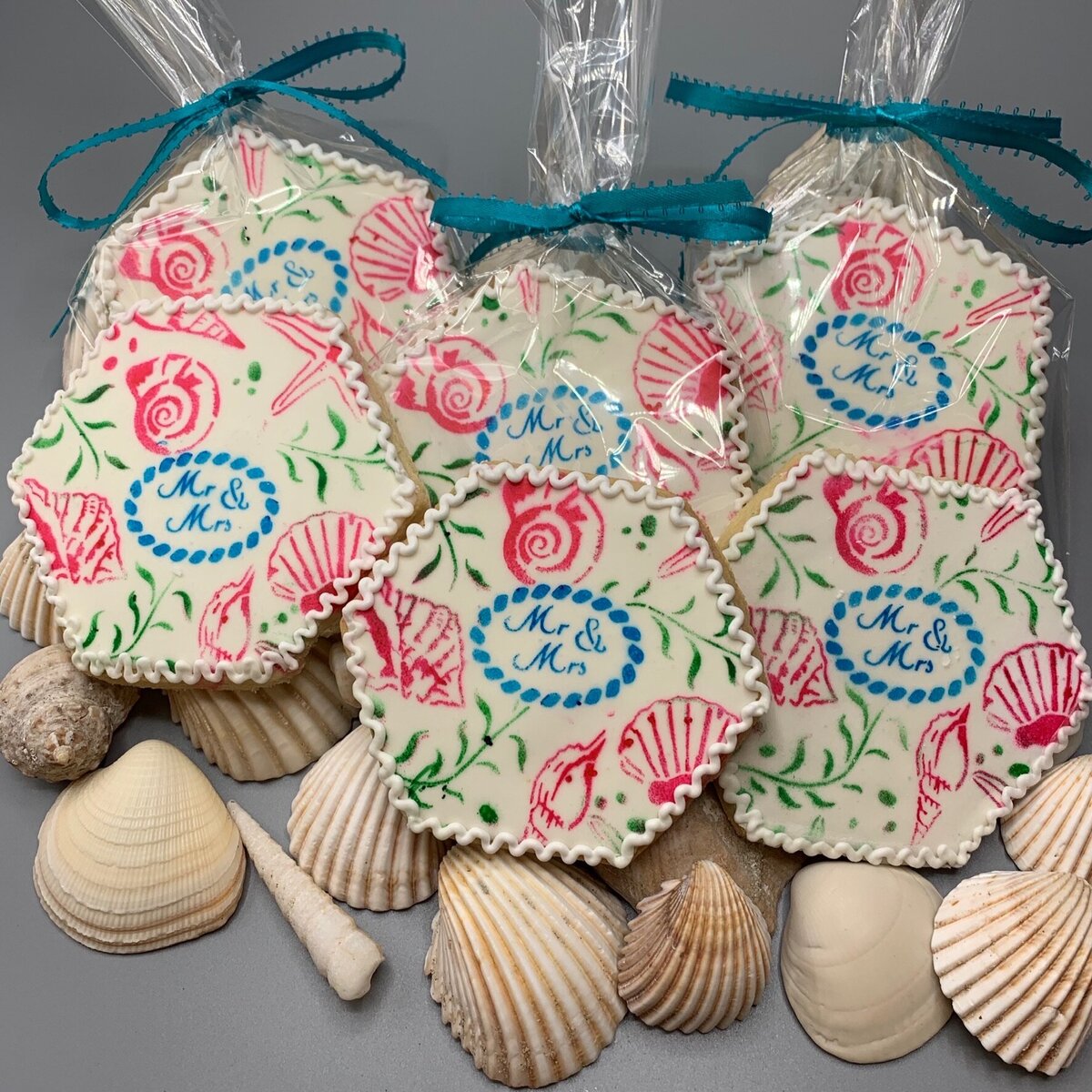 Painted seashell design cookies with Mr and Mrs stencil