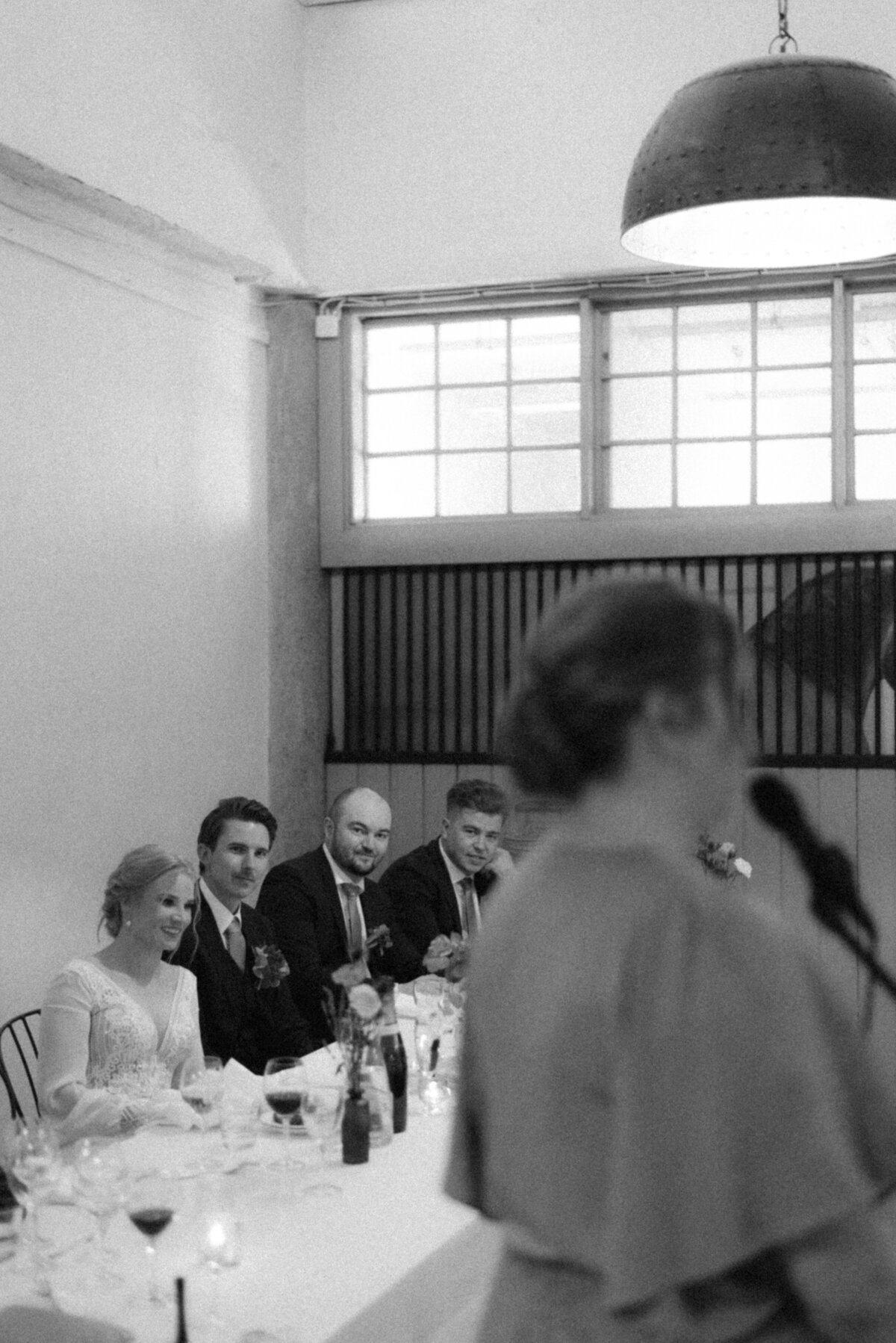 A documentary wedding  photo of the speeches in Oitbacka gård captured by wedding photographer Hannika Gabrielsson in Finland