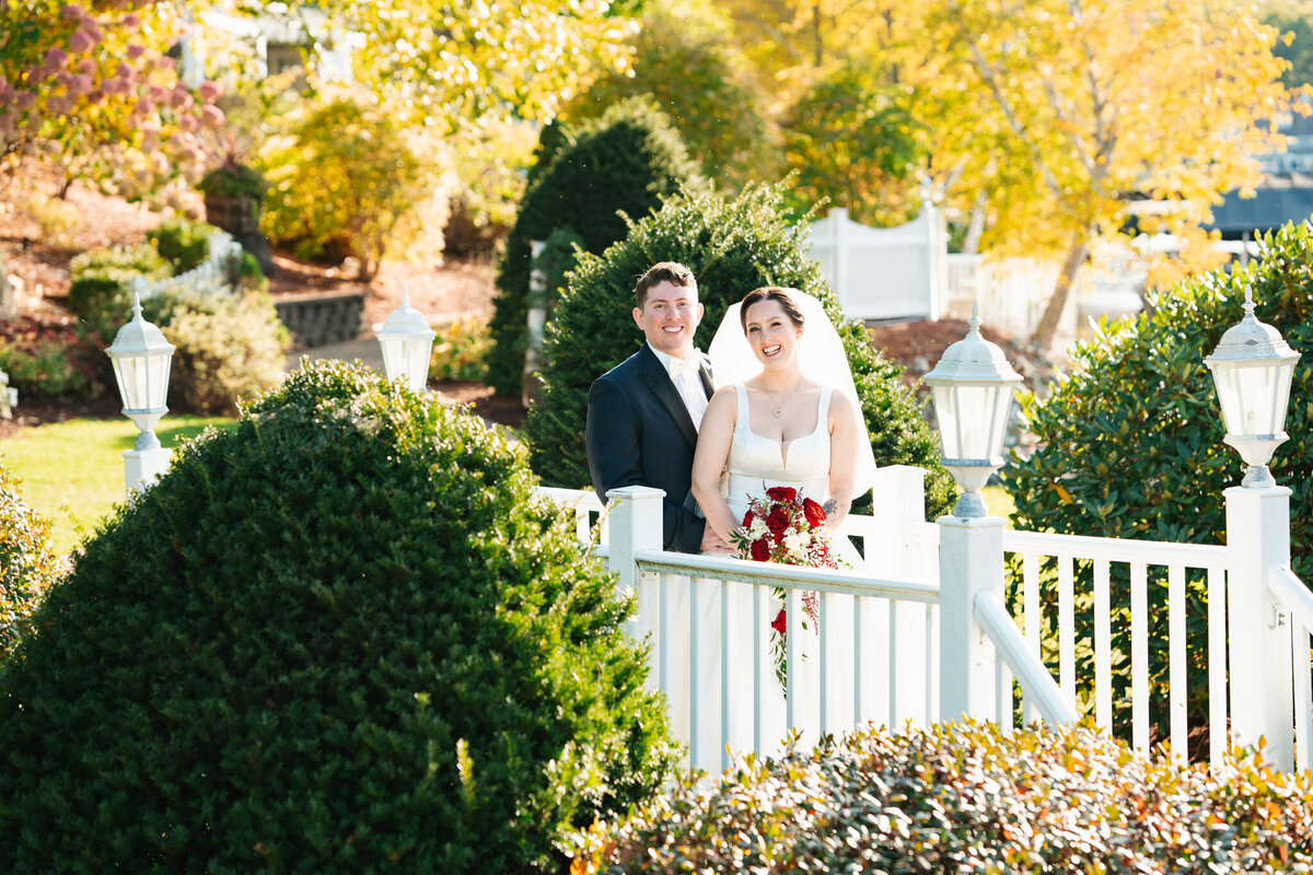 Bride and groom portraits at Castleton in Windham NH with beautiful lake views.