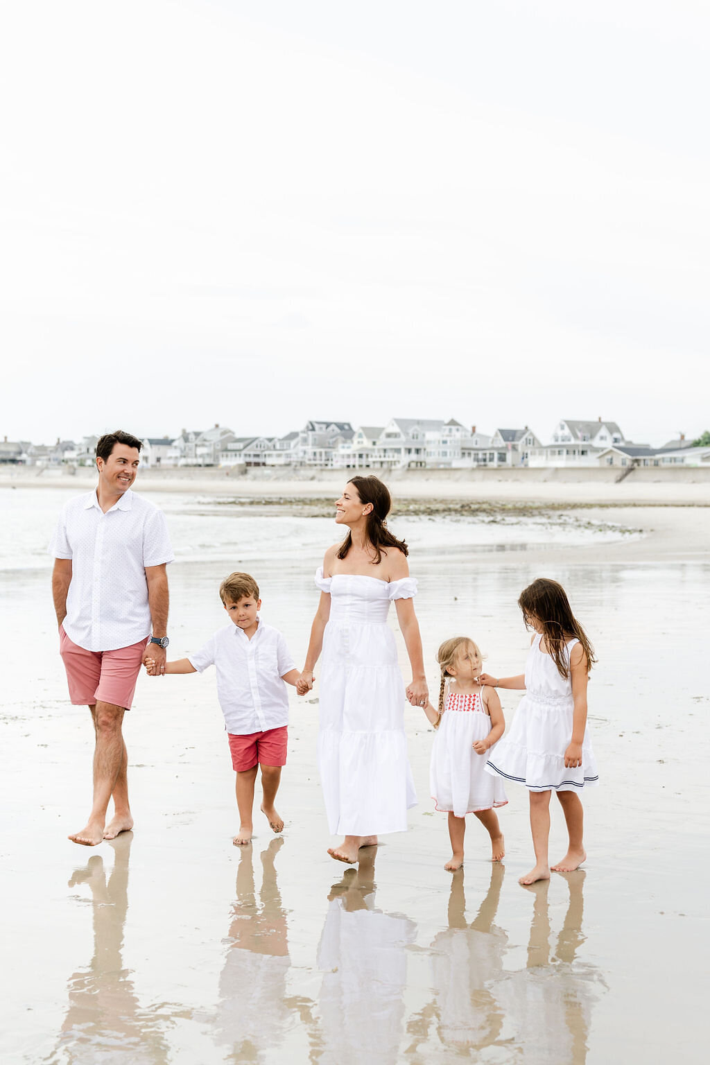 Walking shot of family on the south shore beach