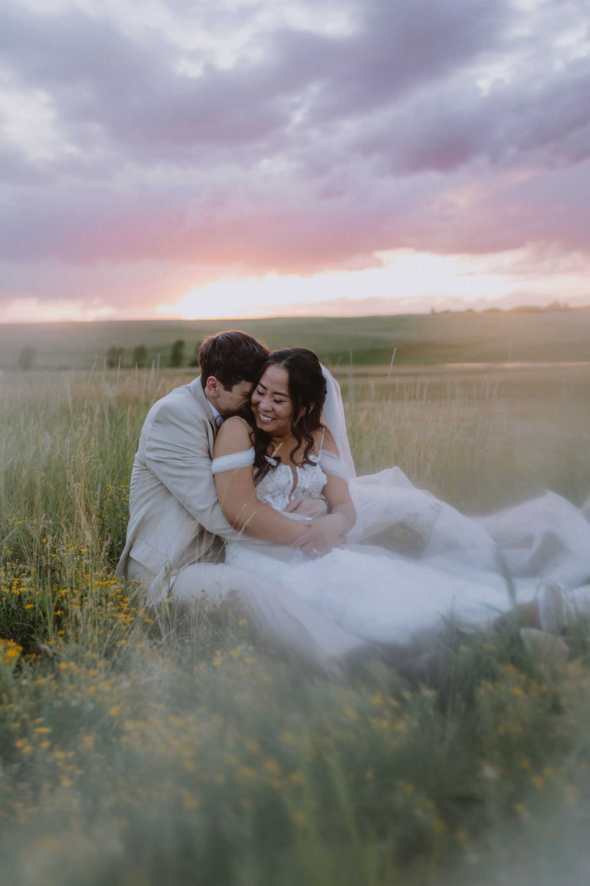 Photographer capturing sunrise portraits at a mountaintop retreat shoot.
