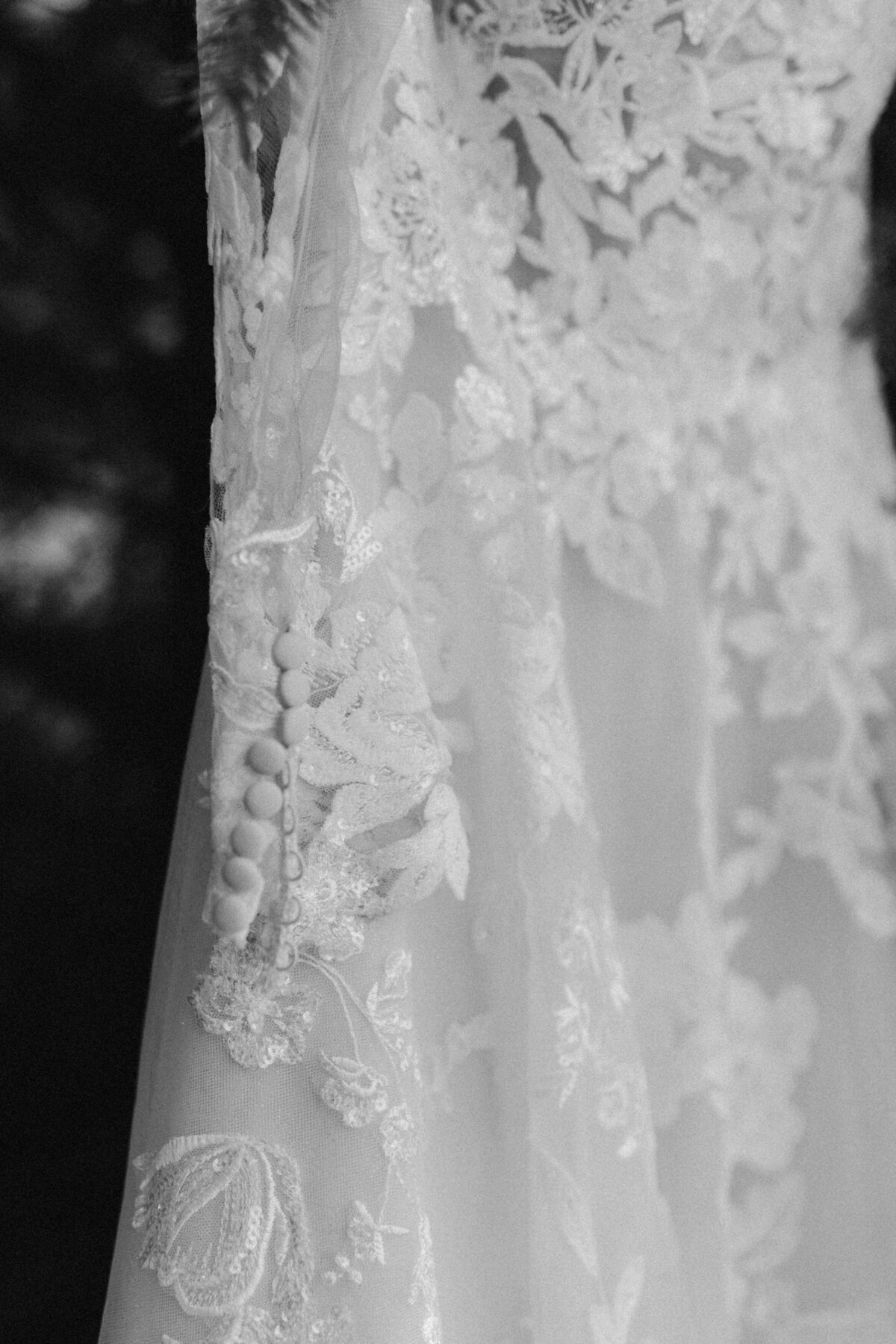 close up black and white photo of a wedding dress