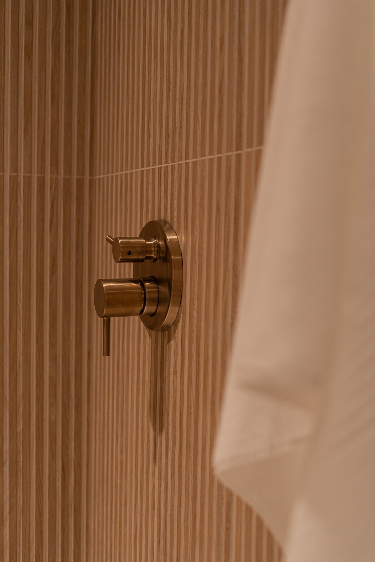 natural-wood-gold-faucet-shower