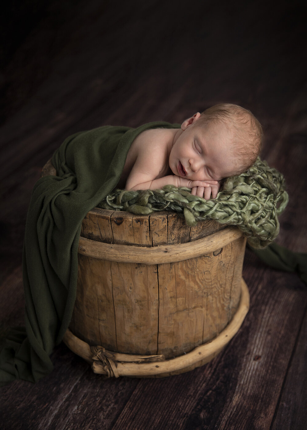 NEWBORN_BABYBOYINABASKETGREEN