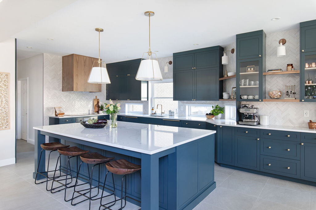 hello-home-austin-contemporary-navy-kitchen-remodel-wood-vent-hood-zelliege-herringbone-backsplash-open-layout-1