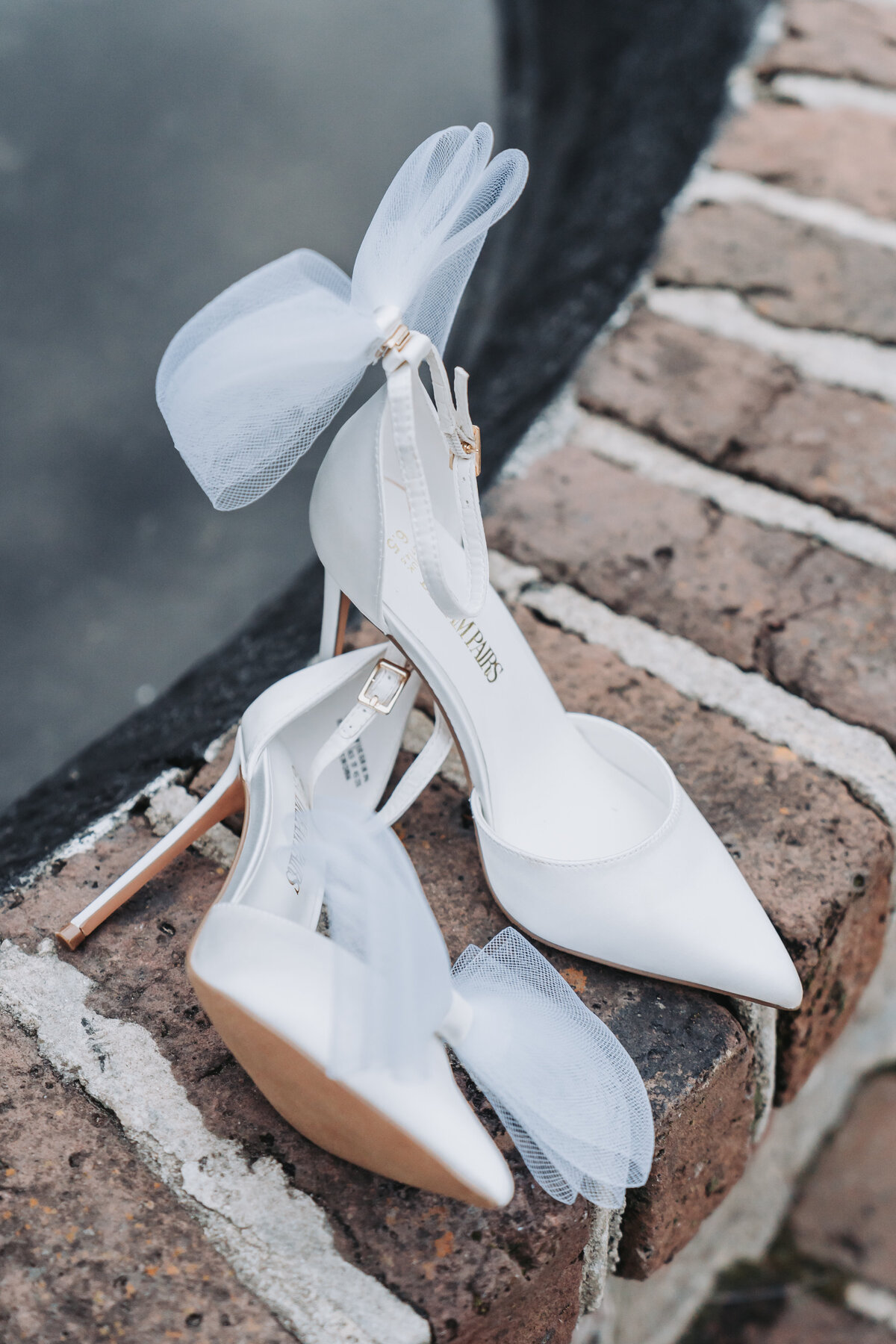 White wedding shoes with a white bow