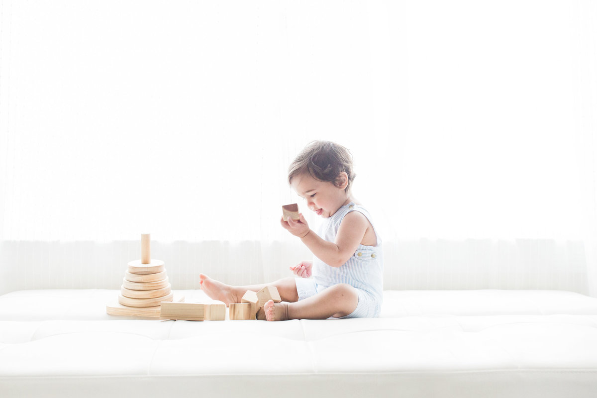 little boy playing with blocks