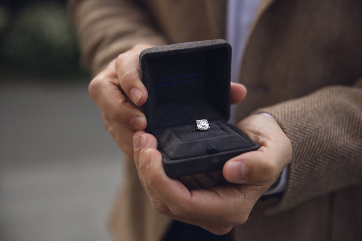 close up of engagement ring inside the black velvet box