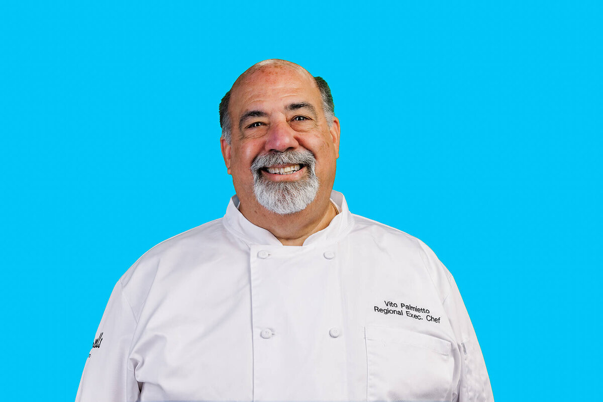 Blue background headshot