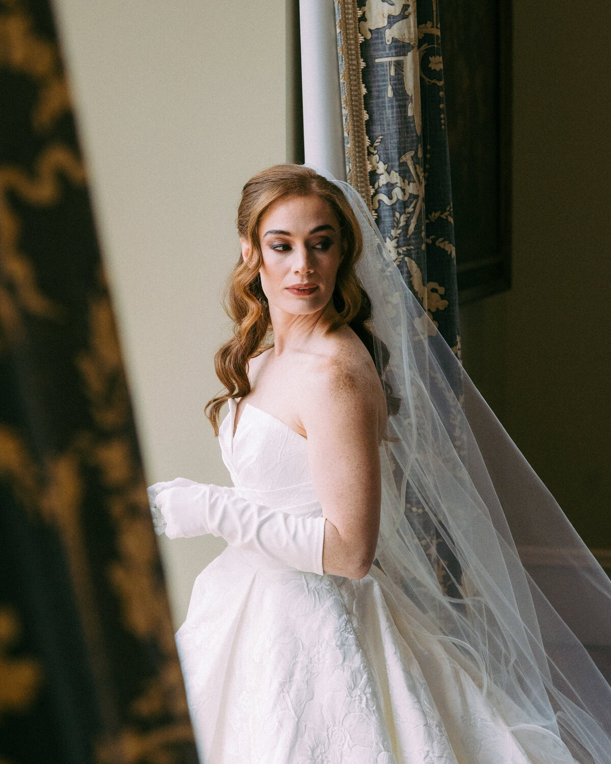 A Bride looking over her shoulder at the Wadsworth Mansion.