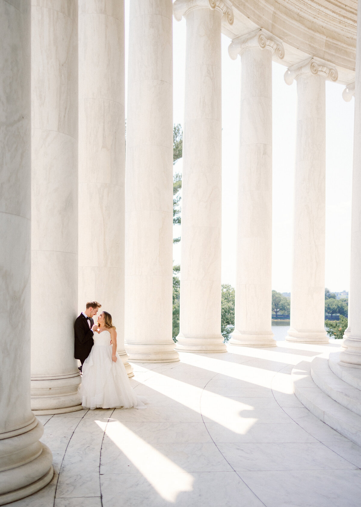 Couple stands in jefferson memorial