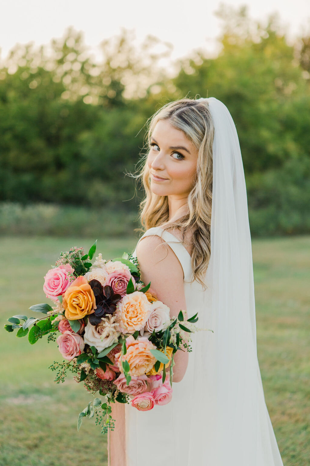 Bride with lush wedding bouquet by Vella Nest Floral Design, Dallas Fort Worth Wedding Florist