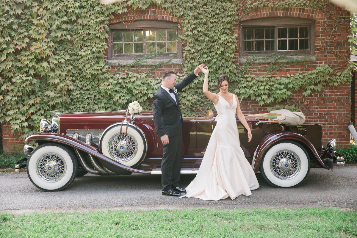 Bride & Groom in front of  vintage car at The Hermitage Museum