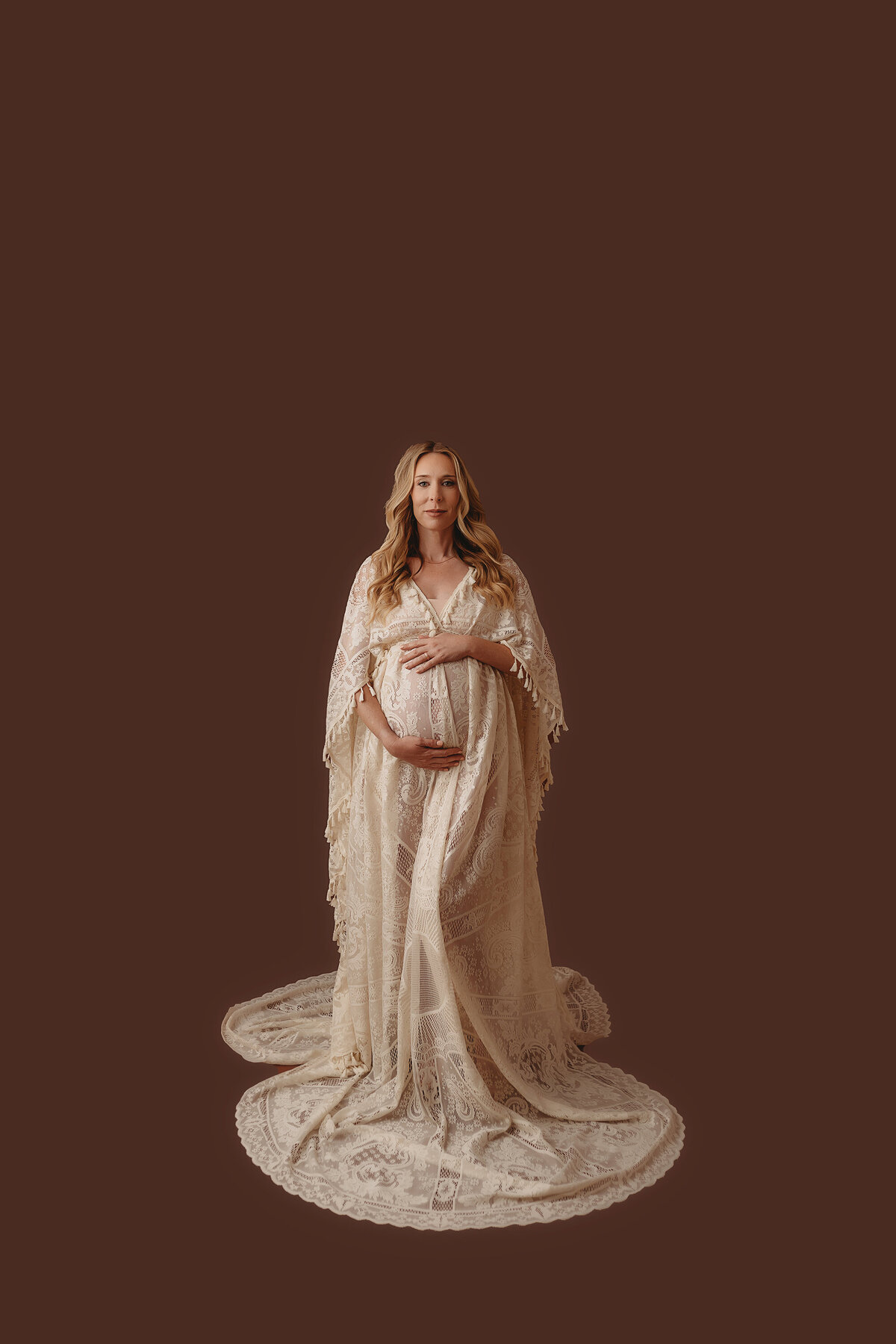 Pregnant mother poses for Maternity Photoshoot in Charleston, SC photo studio. 