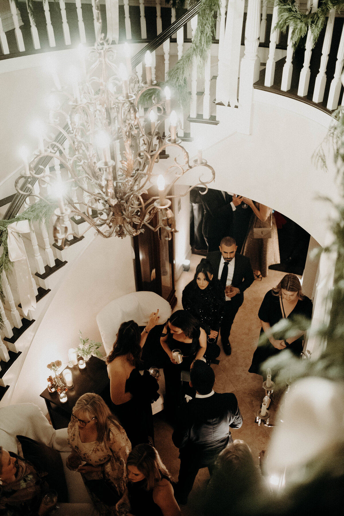 cocktail hour wedding photography guests spiral staircase