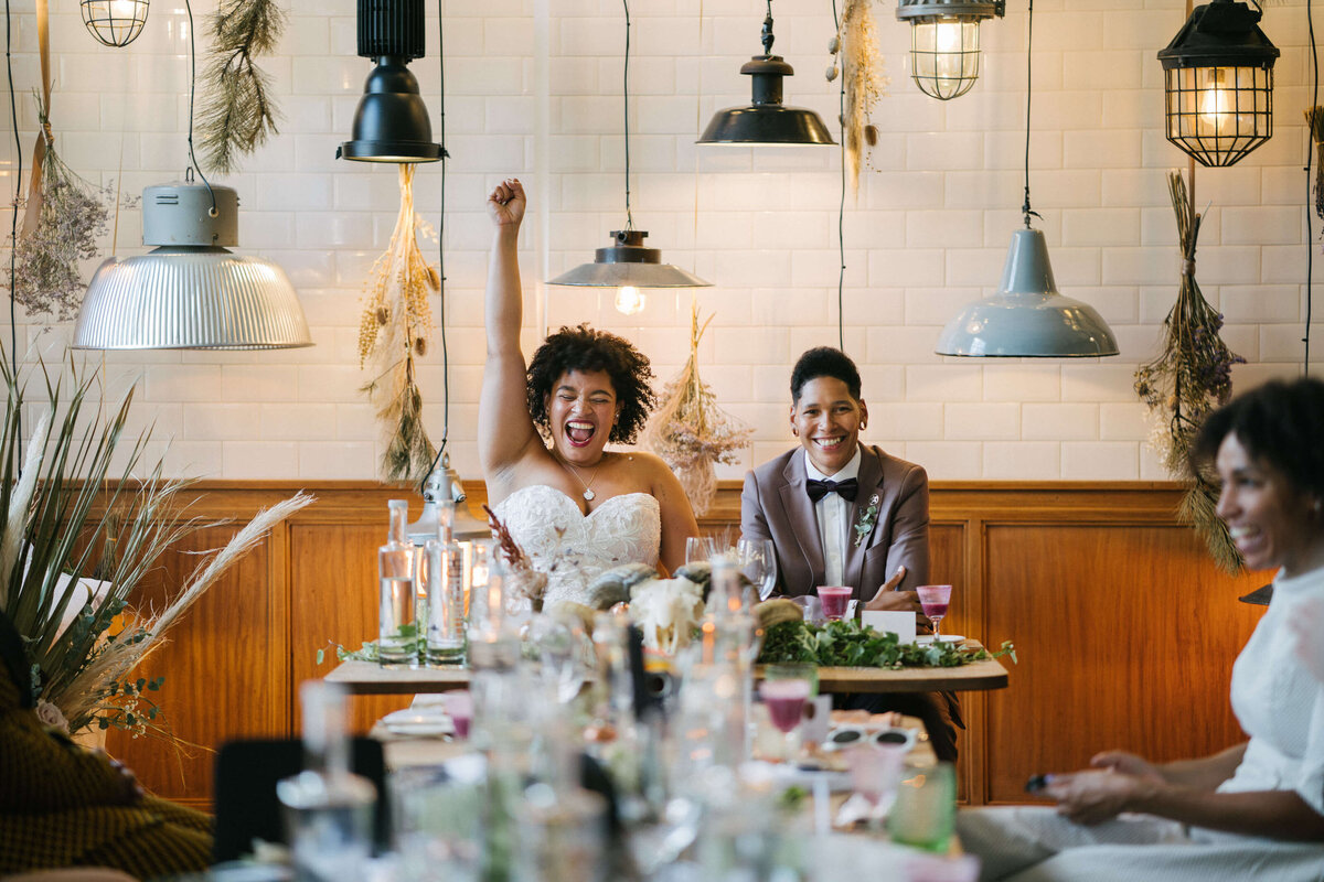 A couple celebrating during their speeches