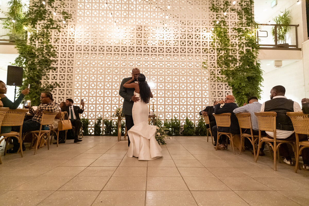 A photo at hart and mains ceremony space in front of the breeze block wall