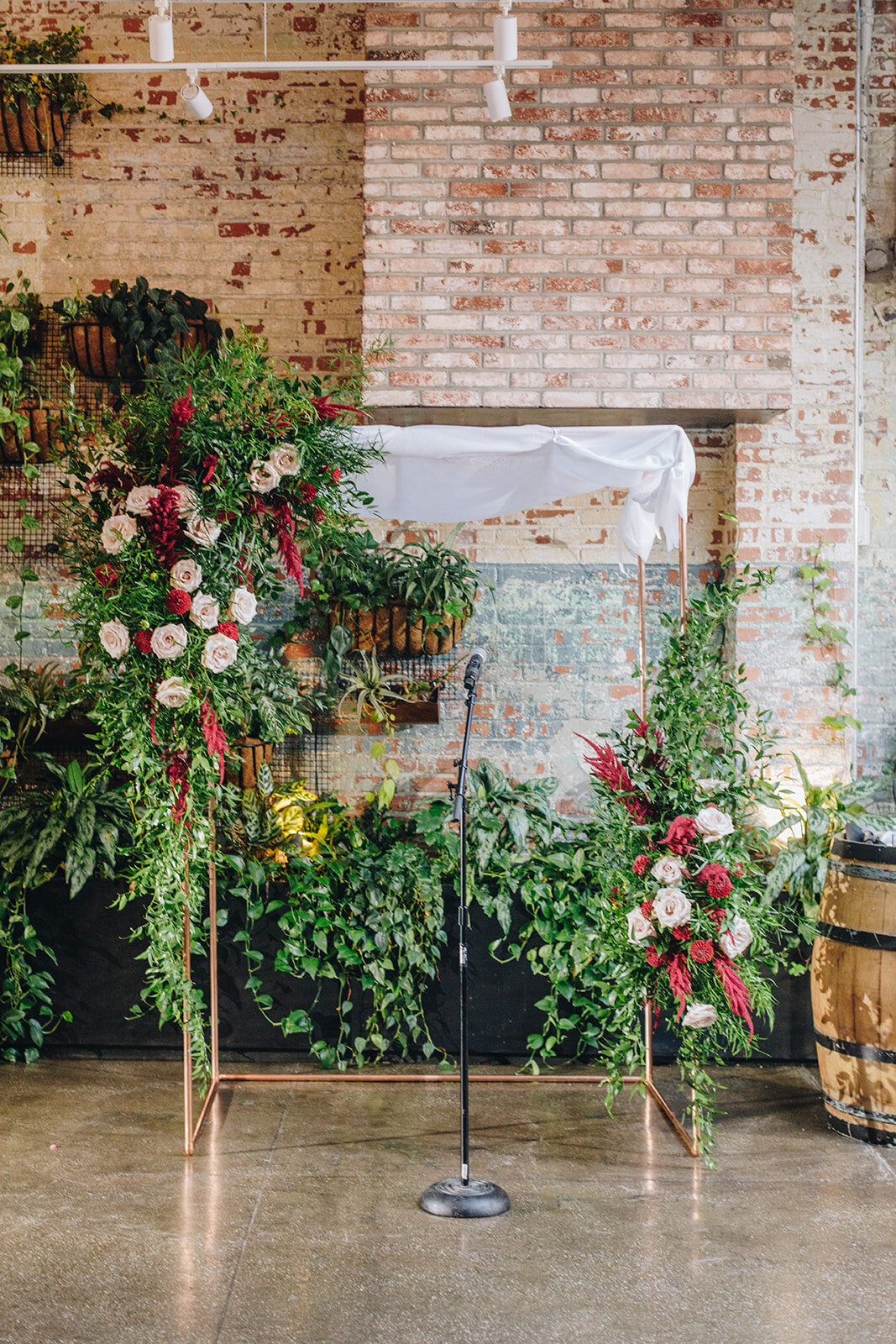 wedding ceremony space decorated with flowers from Lucy's Flowers at brooklyn Winery 