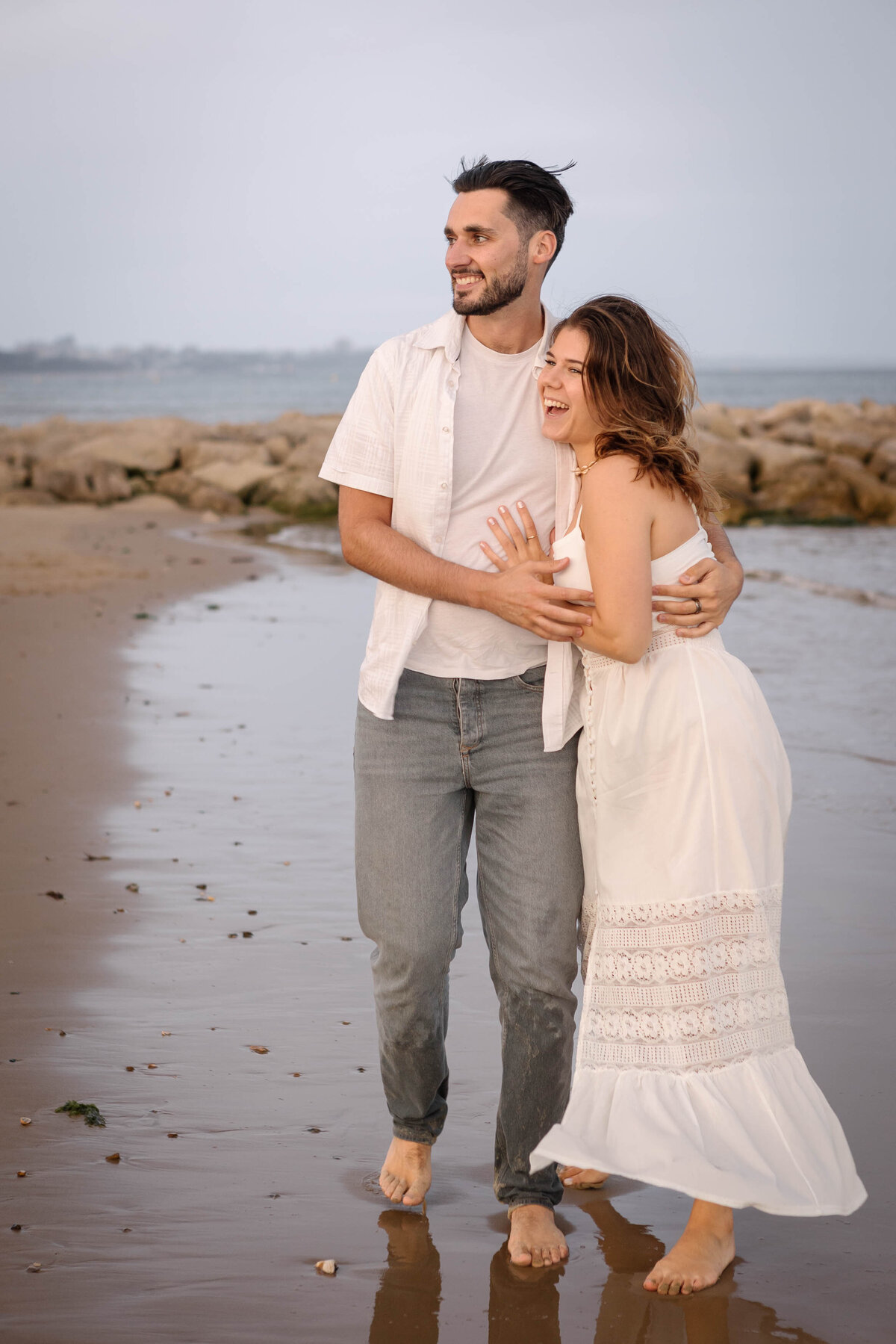 A couple playing in on the seashore