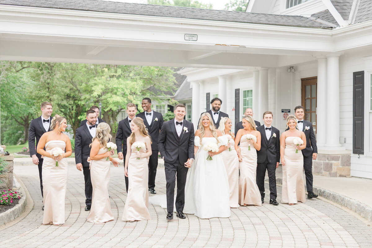 Bridal party walking outside a venue in Grand Rapids Michigan.