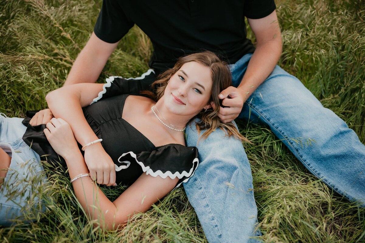 couple laying in grass field in amarillo texas, , Emily wheeler photography