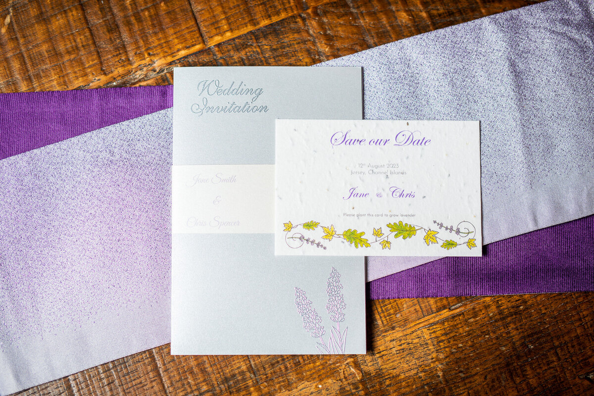 Handcrafted wedding suite featuring lavender seed paper Save the Suite and lavender embossed invitation