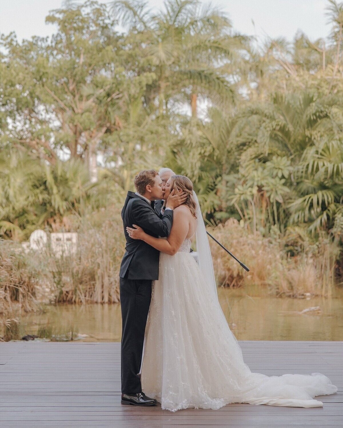 Couple kissing at wedding, planned by destination wedding travel agent, CC Vacations