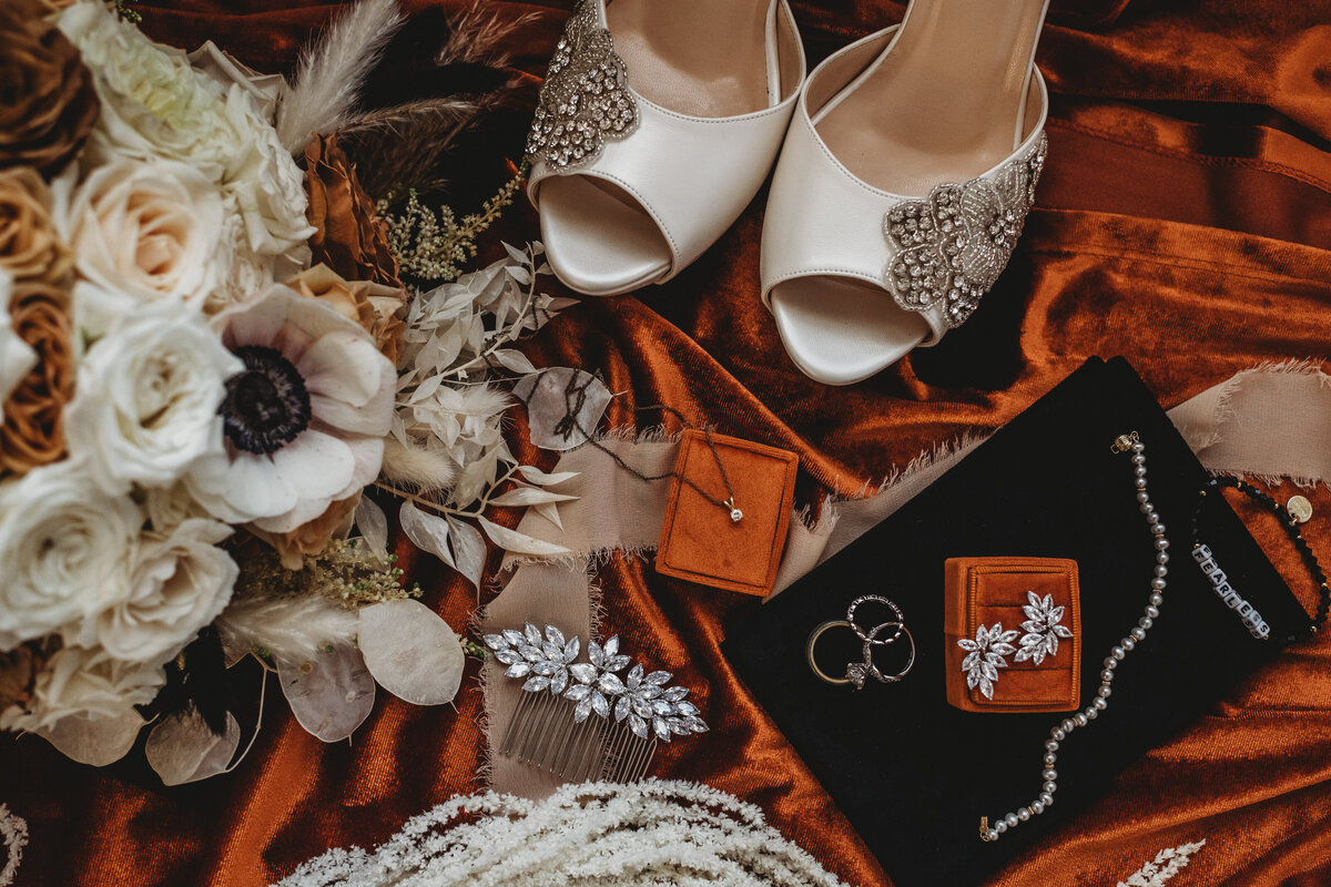 Maryland wedding photographer styles and captures wedding details with brides shoes jewelry and florals together