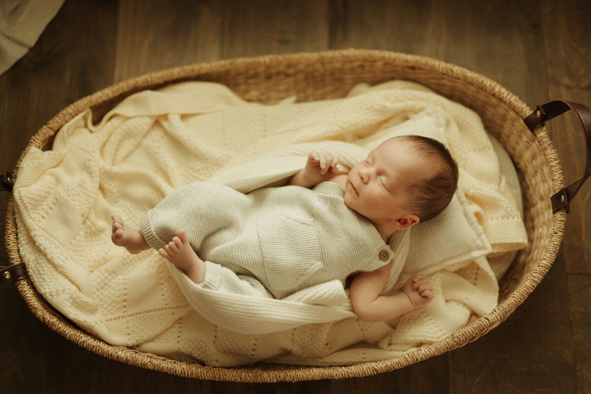 Baby lying on bed in Franklin TN home during lifestyle newborn session