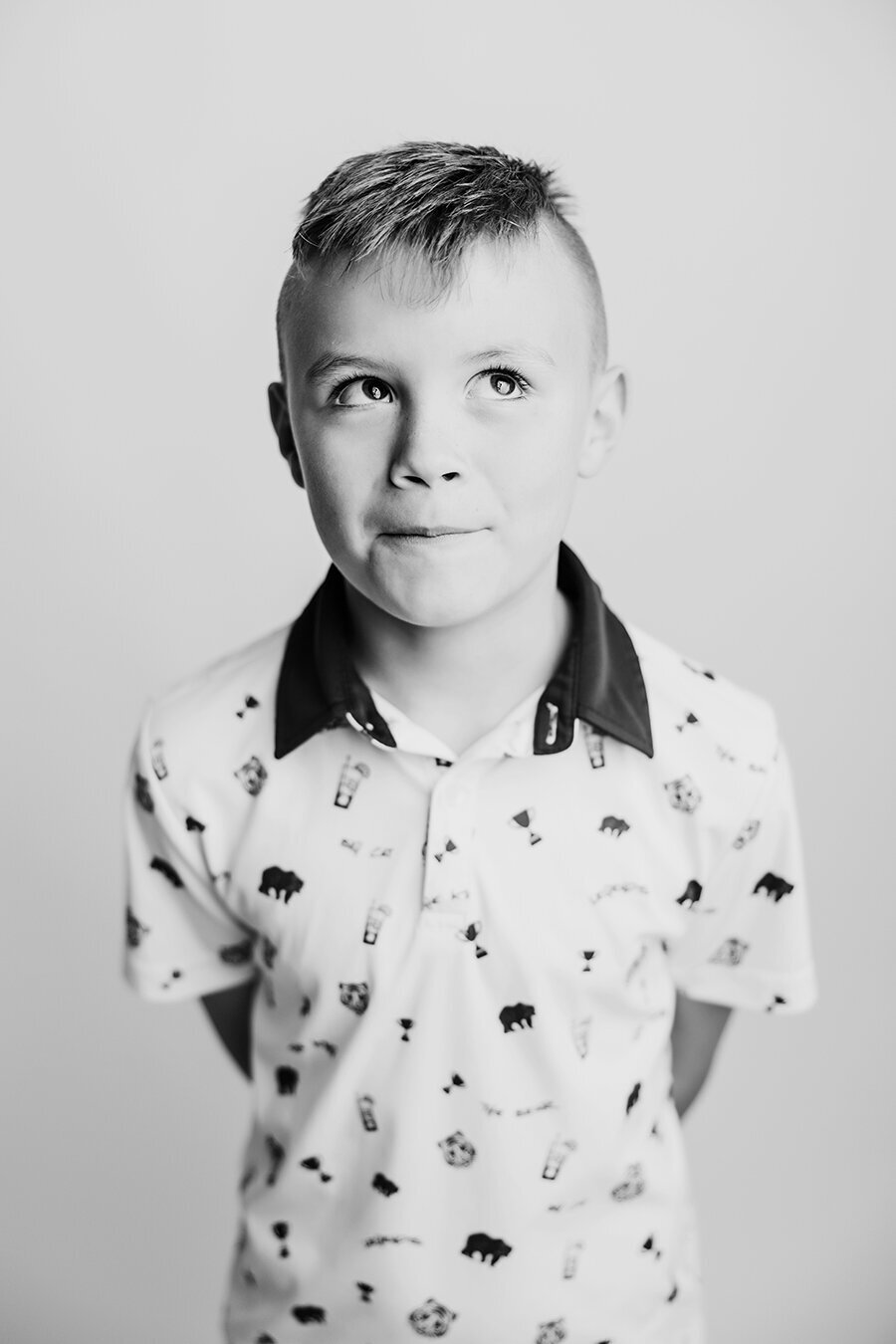 Little boy making a sill face in a black and white photo