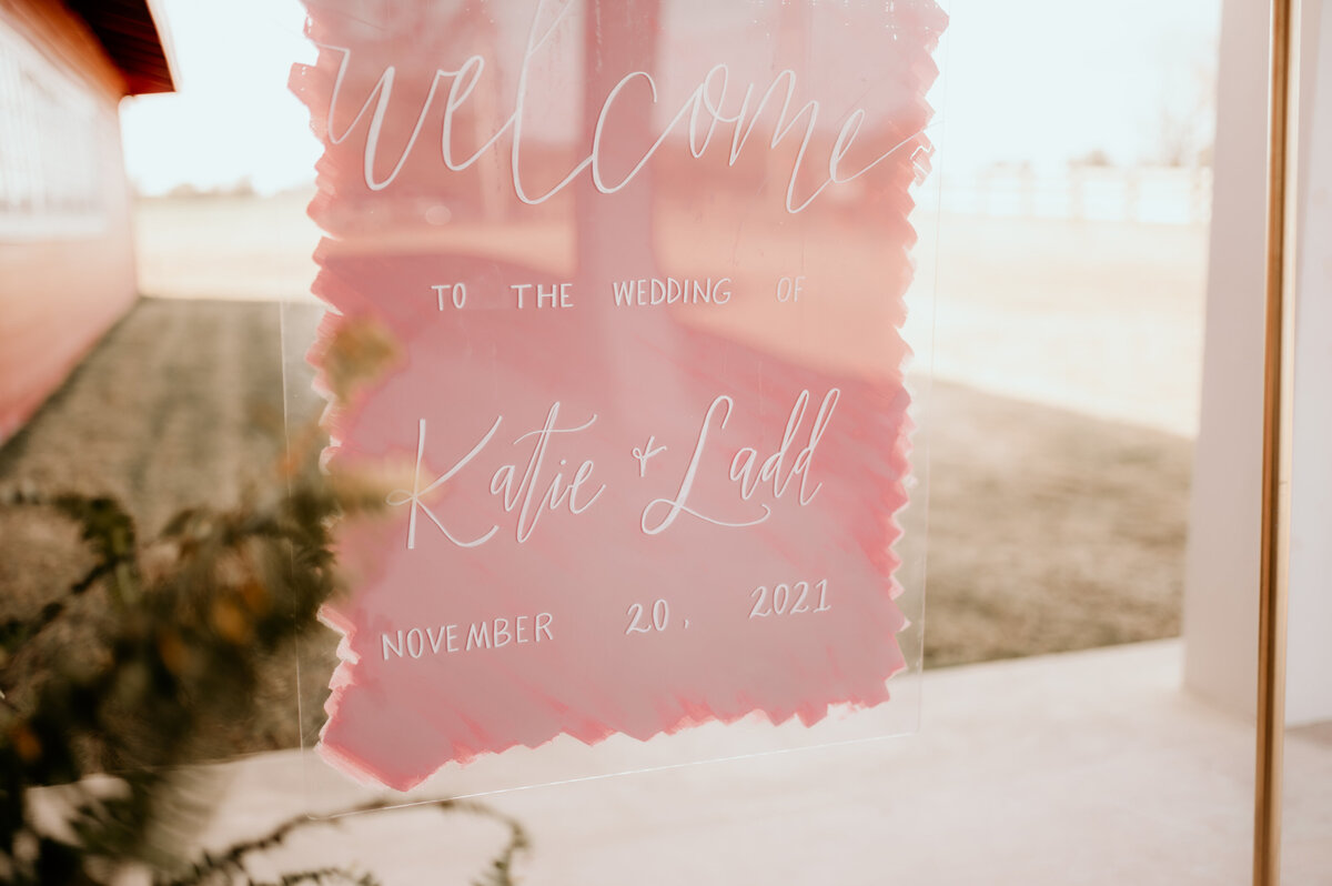 glass sign with pink detail  paint for little rock ar wedding