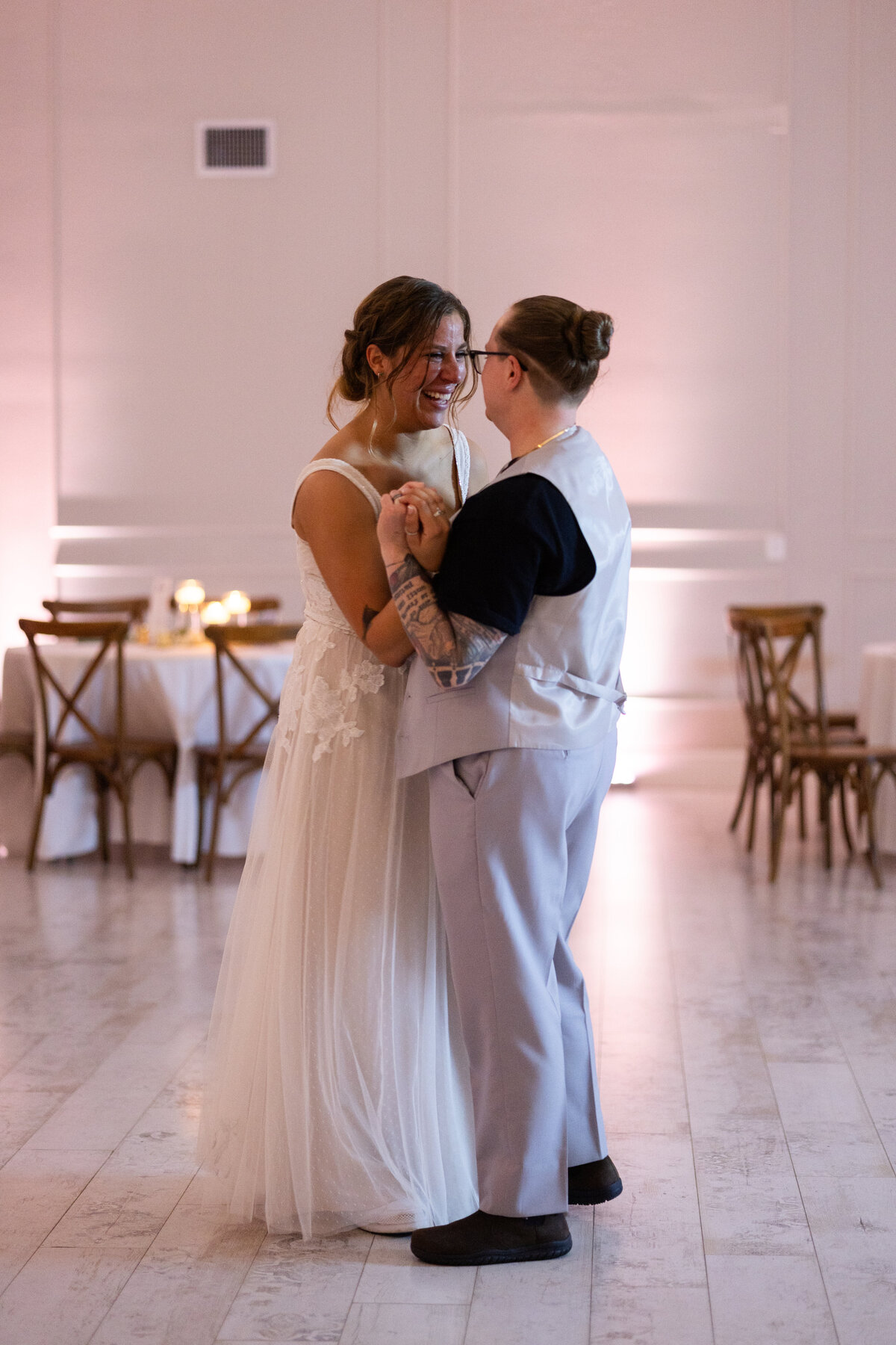 lgbtq couple dancing at Cypress Creek Farmhouse in Astatula Florida by Amanda Richardson Photography