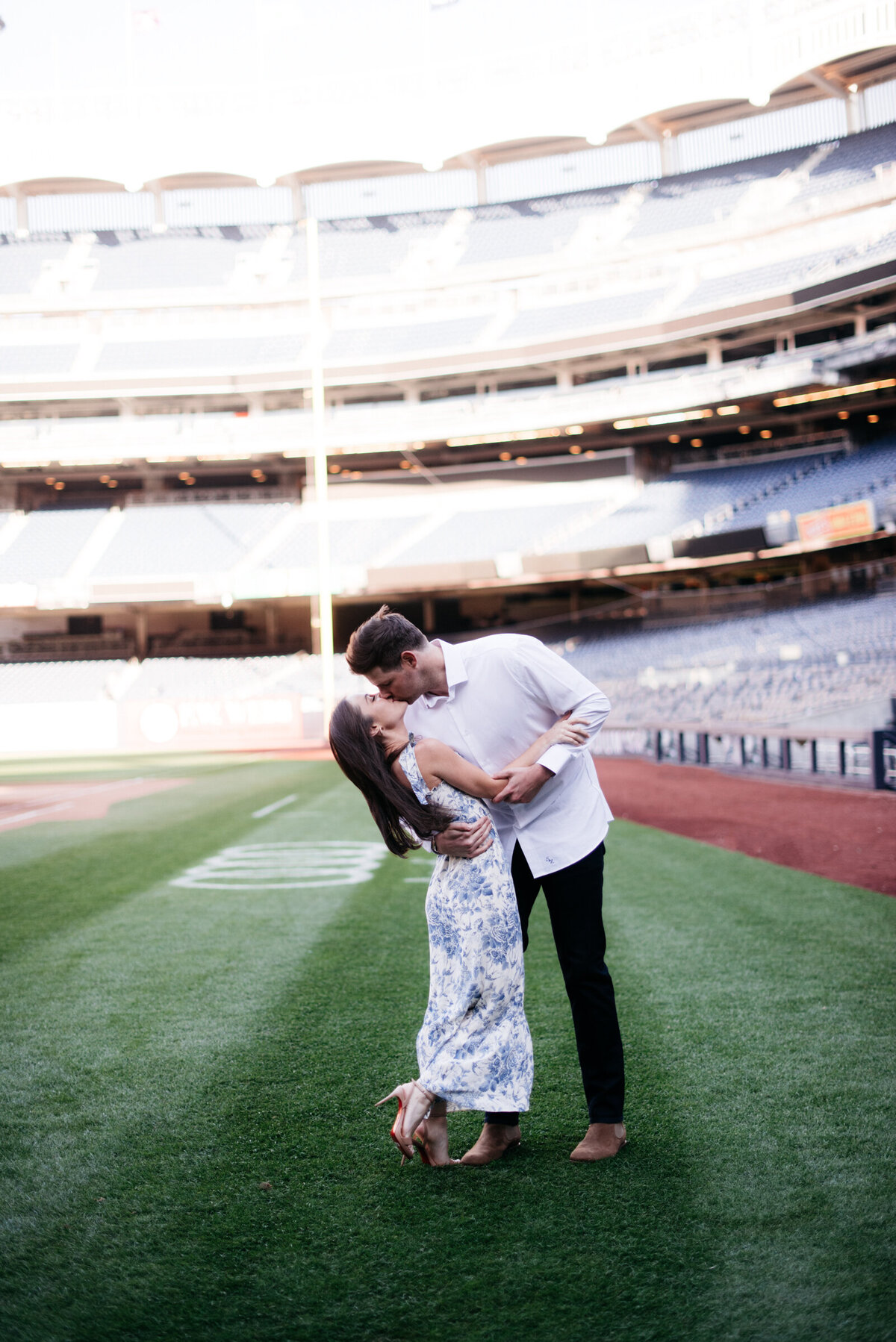 couple posing in yankee stadium engagement photos