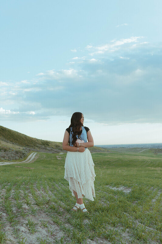A woman holds her Book of Mormon as Brittney takes a missionary portrait of her in Rexburg, ID.