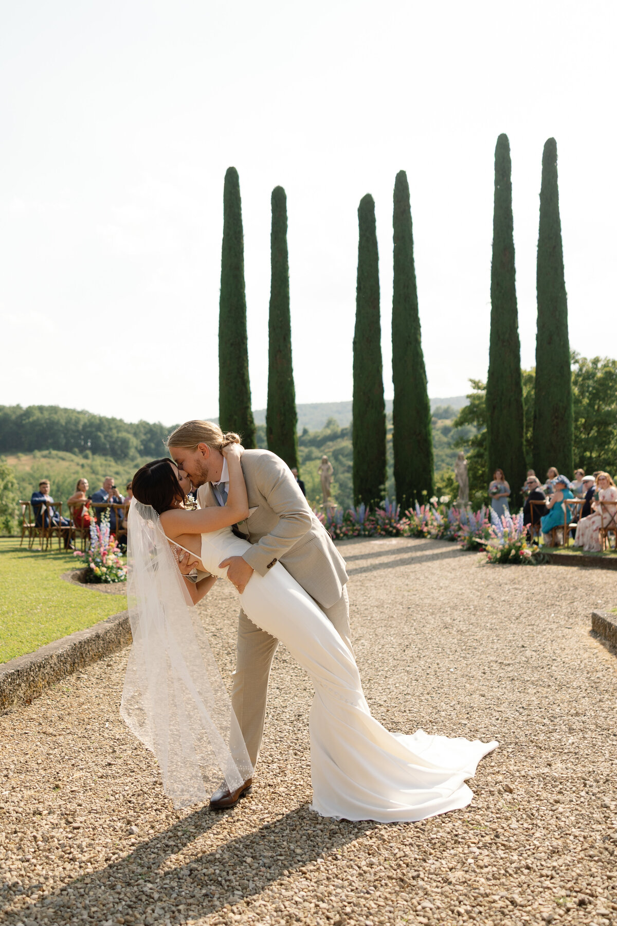 Just married couple walking down the aisle at Villa La Selva wedding