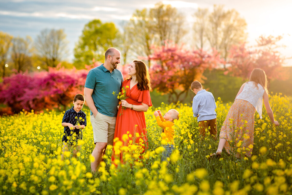 Family in a field of yellow flowers in Harrisonburg, VA